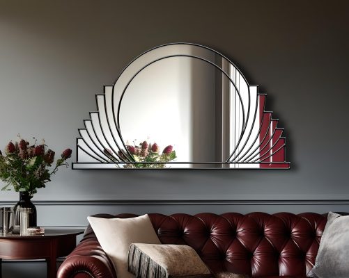 Messina Majesty Deco Mirror: A stunning Art Deco masterpiece with a central circular mirror, surrounded by gracefully sweeping mirror sections, featuring radiant gold trim. Handcrafted by artist Phillip Orr exclusively for Mirror Mania in Norfolk, England. Customizable in black or silver trim, this timeless design boasts beautiful symmetric curves, offering a touch of sophistication to any space.